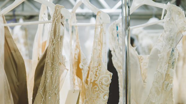 Background,, embroidered lace. Delicate detail of a wedding dress close-up.
